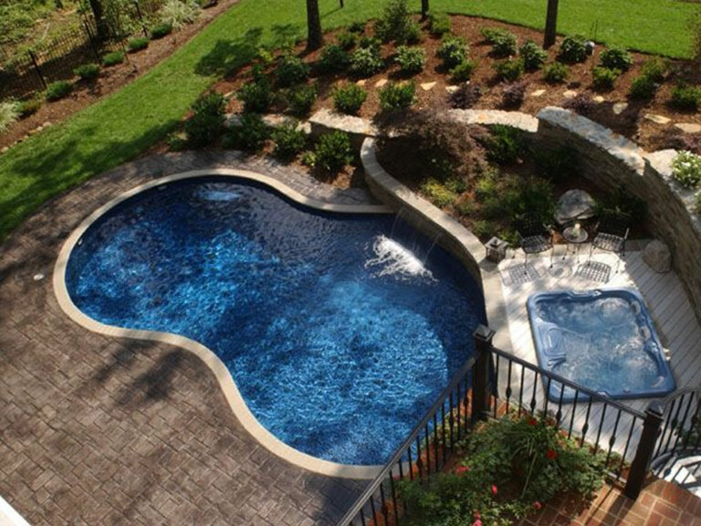 Freeform pool with sap and raised wall