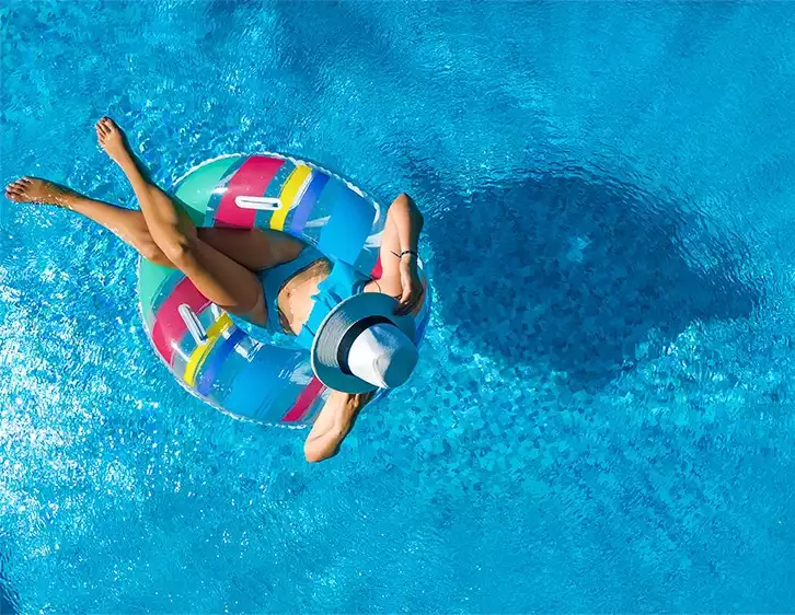 girl swimming and relaxing in pool