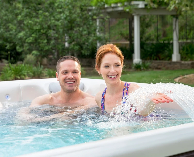 Couple in a hot tub at Johnson Pools & Spas